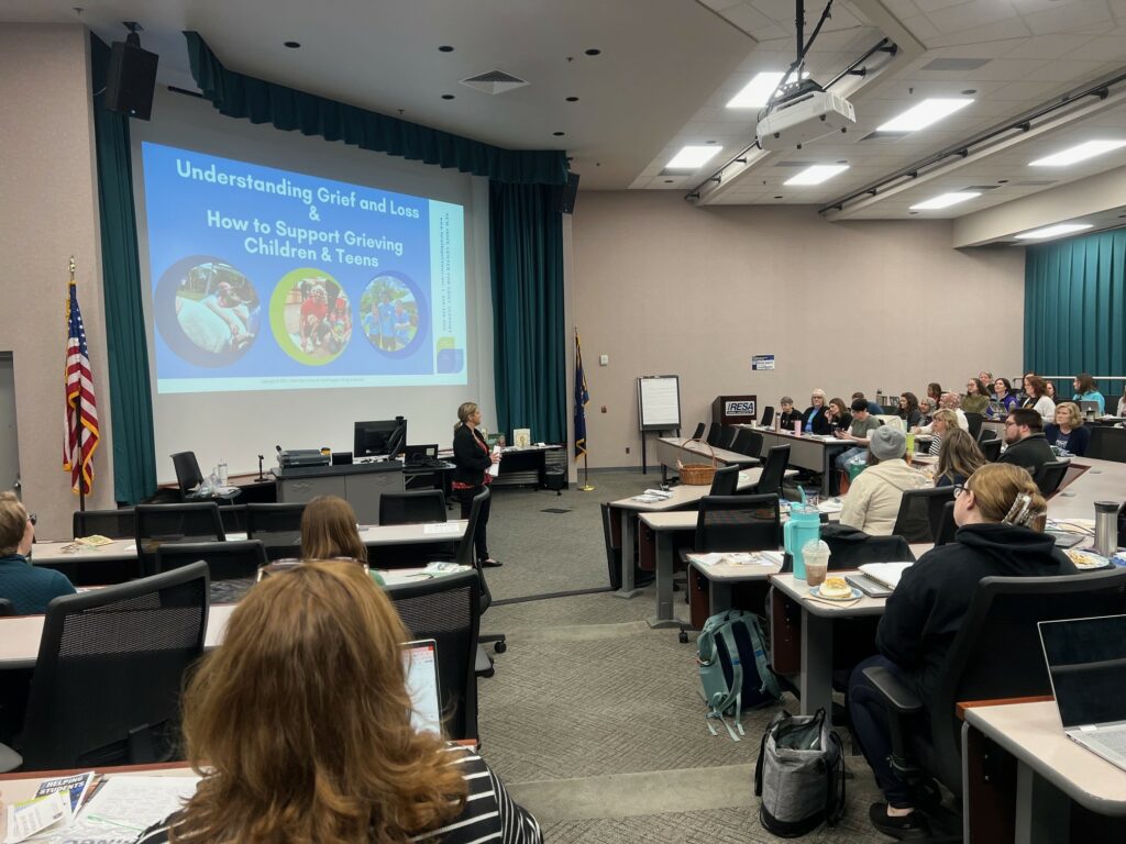 woman presenting in a lecture hall